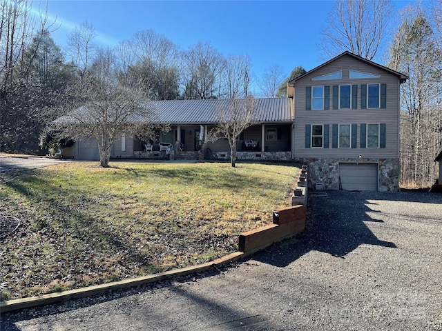 view of front of home with a garage and a front yard