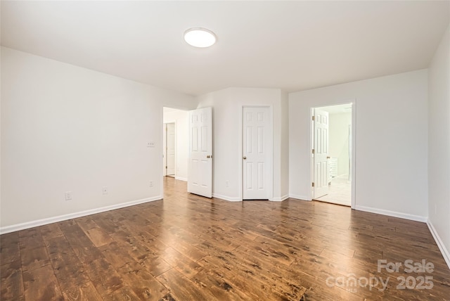 unfurnished room featuring dark hardwood / wood-style floors