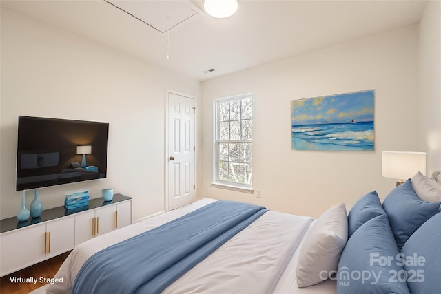 bedroom with wood-type flooring