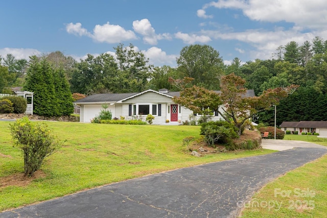 ranch-style house with a front lawn and a garage