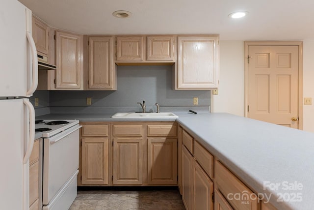 kitchen with sink, white appliances, and light brown cabinets