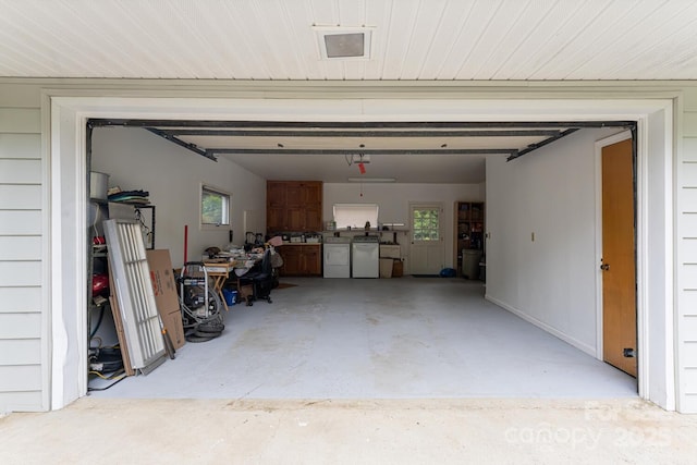 garage with washing machine and dryer