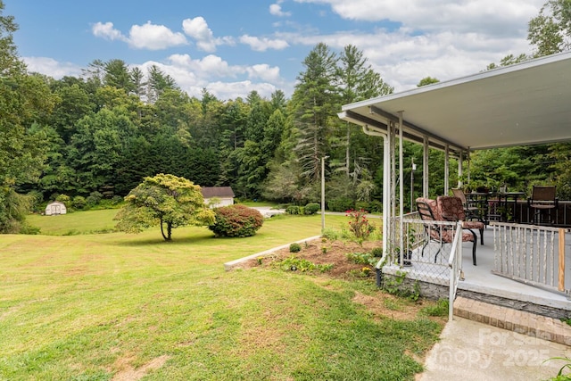 view of yard featuring covered porch