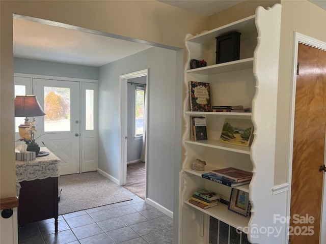 interior space featuring light colored carpet