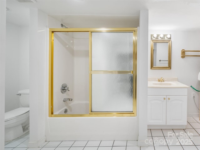 full bathroom with tile patterned flooring, vanity, toilet, and enclosed tub / shower combo