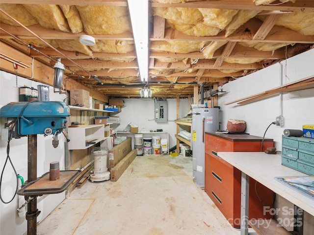 basement with electric water heater and electric panel