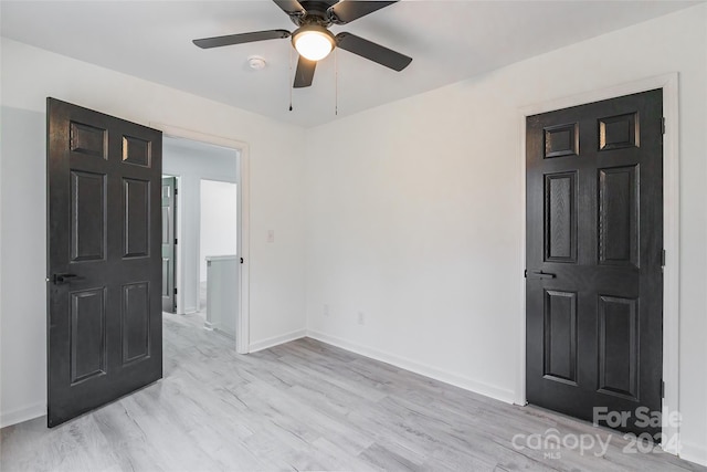 unfurnished room featuring ceiling fan and light hardwood / wood-style flooring