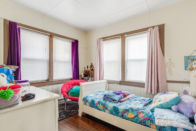 bedroom featuring dark hardwood / wood-style flooring and baseboard heating