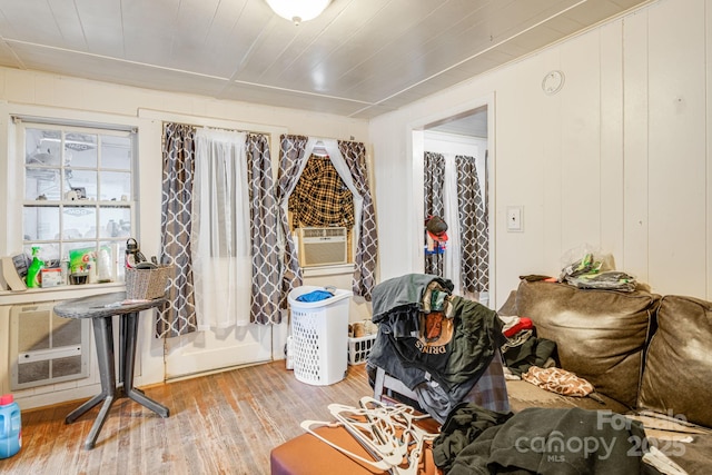 interior space featuring hardwood / wood-style floors, heating unit, and cooling unit