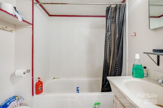 bathroom featuring shower / bath combo and vanity