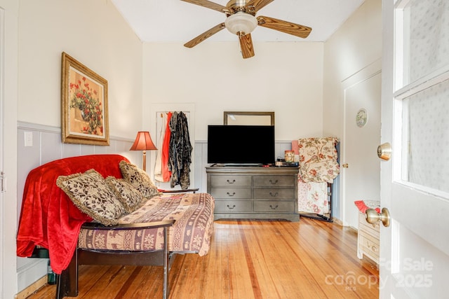 living area with ceiling fan and hardwood / wood-style floors