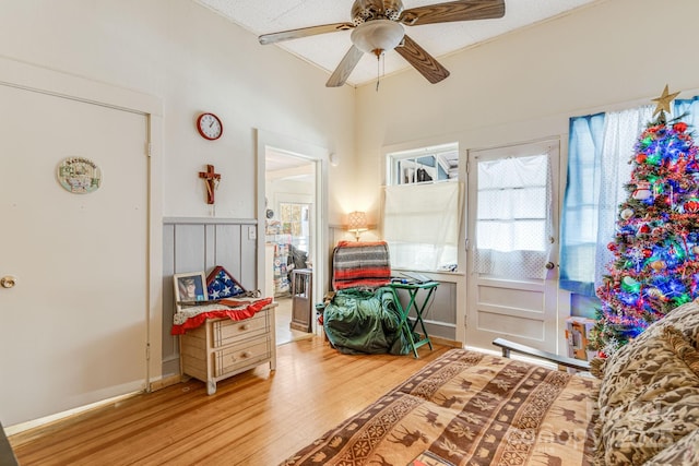 game room with light hardwood / wood-style floors and ceiling fan