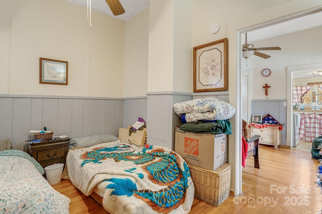 bedroom with ceiling fan and light hardwood / wood-style flooring