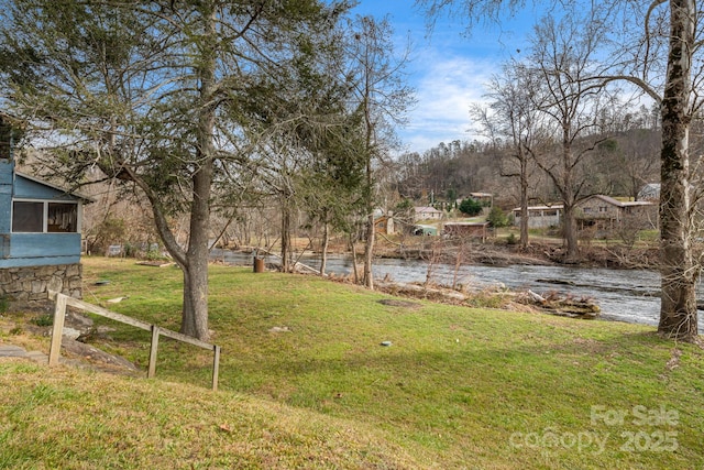 view of yard featuring a water view