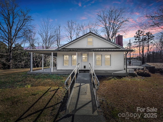 view of front of house with a yard