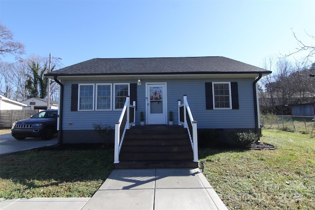 bungalow featuring a front yard