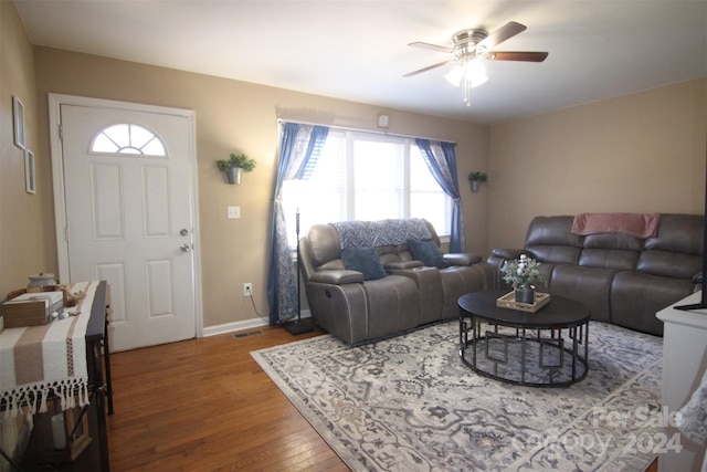 living room with hardwood / wood-style flooring and ceiling fan