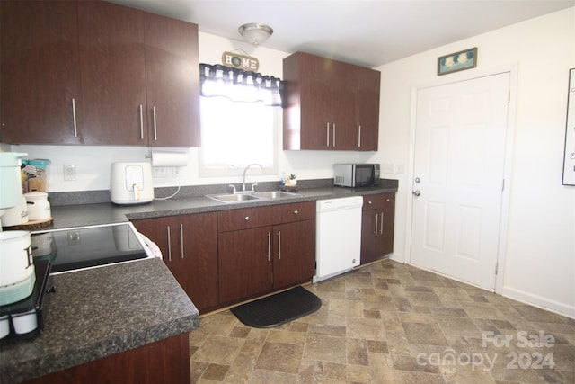 kitchen with dishwasher, dark brown cabinets, and sink