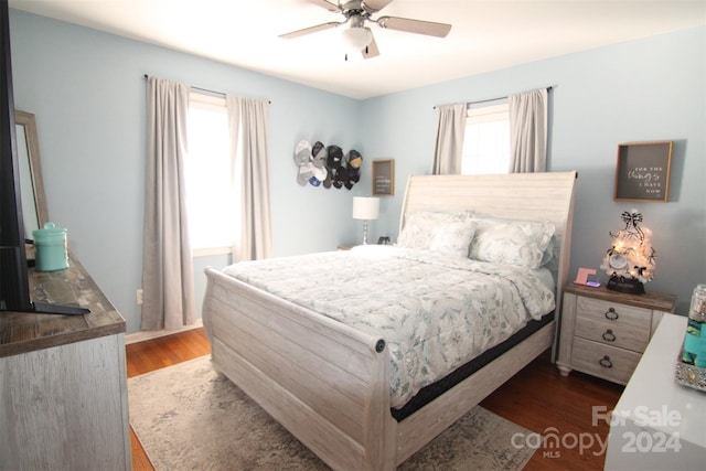 bedroom featuring ceiling fan and dark hardwood / wood-style flooring