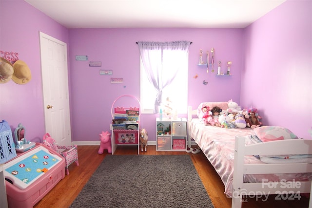 bedroom featuring wood-type flooring