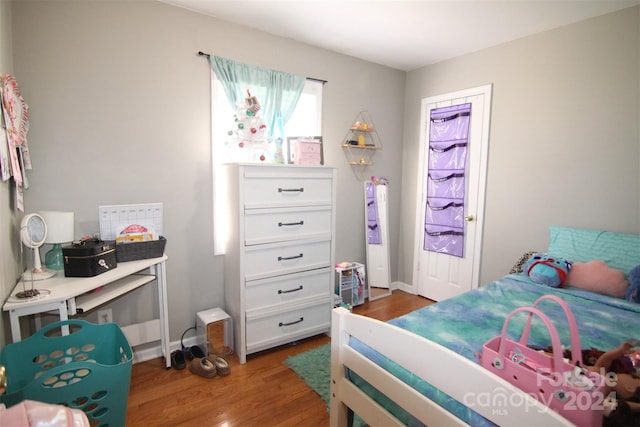 bedroom featuring dark wood-type flooring