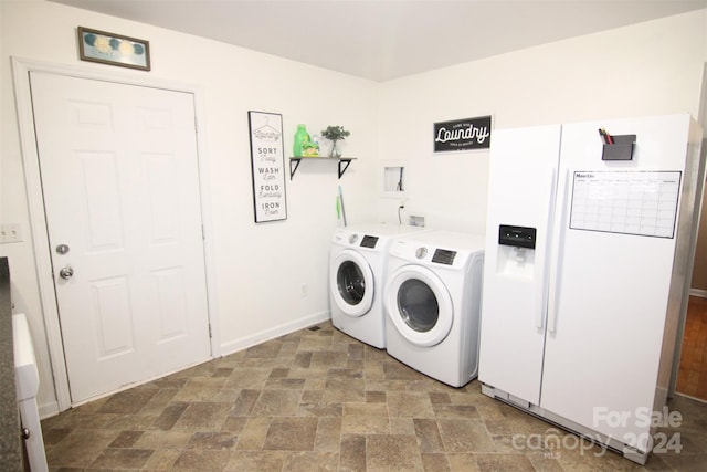 washroom with washer and dryer