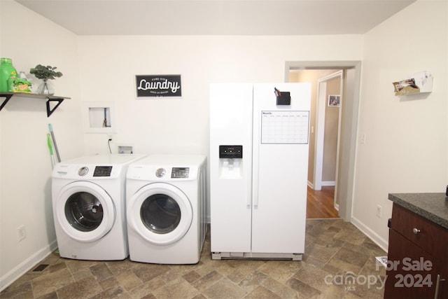 clothes washing area with independent washer and dryer