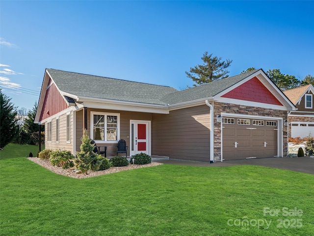 view of front of property featuring a garage, a shingled roof, stone siding, aphalt driveway, and a front lawn