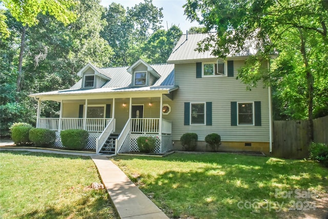 view of front of home with covered porch and a front lawn