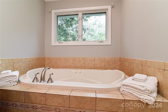 bathroom featuring tiled bath