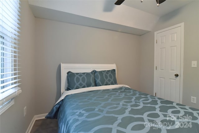 bedroom featuring ceiling fan and vaulted ceiling