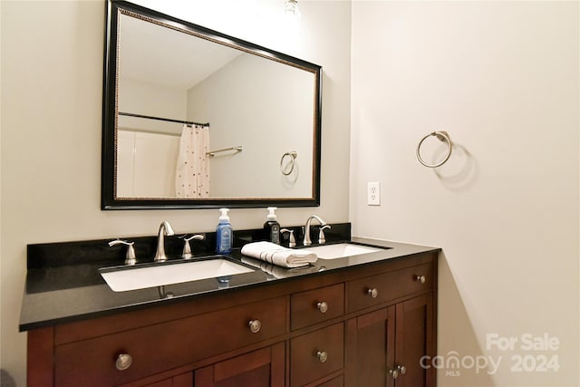 bathroom featuring vanity and walk in shower