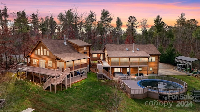 view of back house at dusk