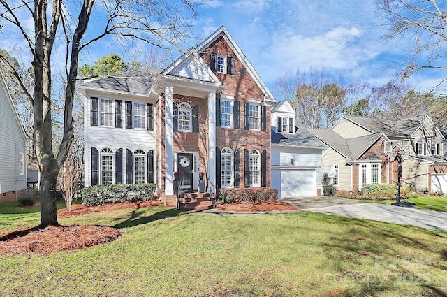 view of front of house featuring a garage and a front lawn