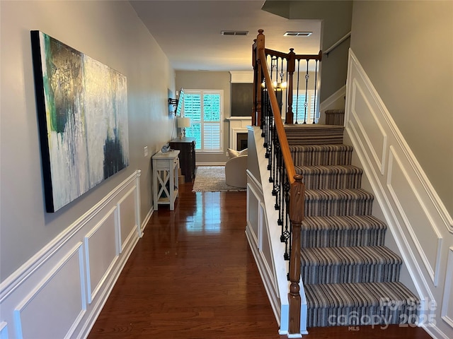 stairway featuring hardwood / wood-style floors