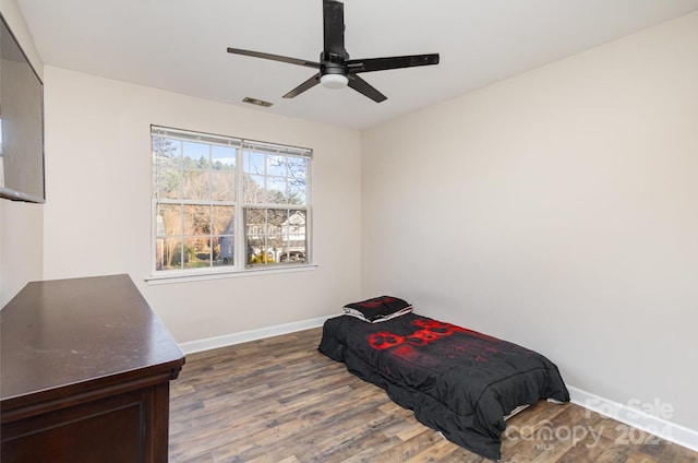 bedroom featuring ceiling fan and wood-type flooring