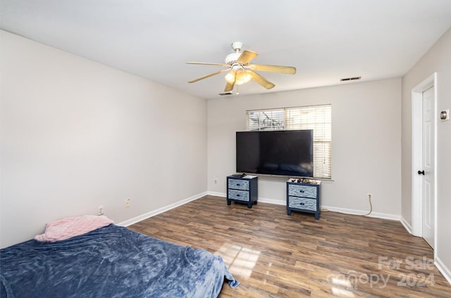 bedroom with ceiling fan and wood-type flooring