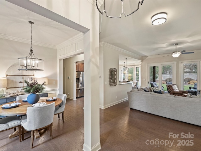 living room featuring ceiling fan, dark hardwood / wood-style flooring, and crown molding