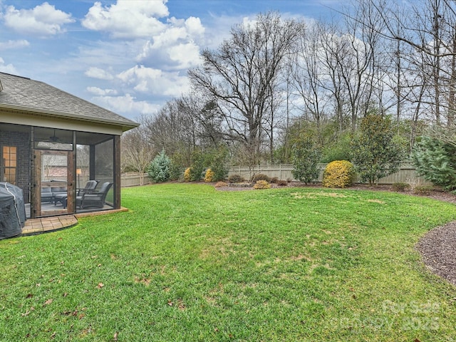 view of yard with a sunroom