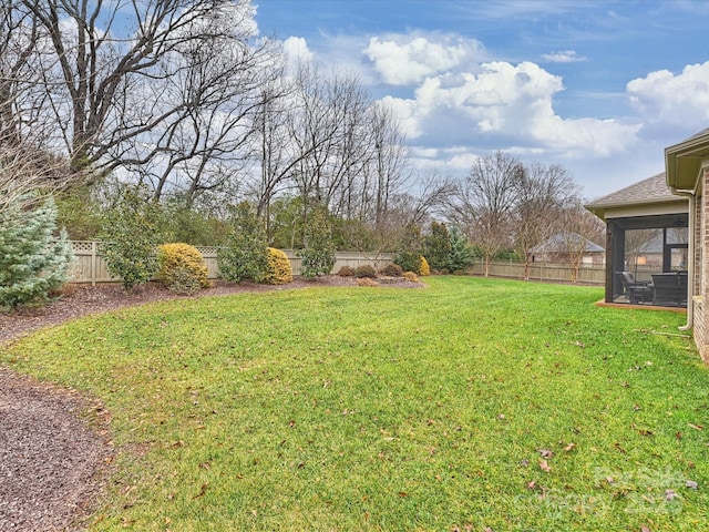 view of yard with a sunroom