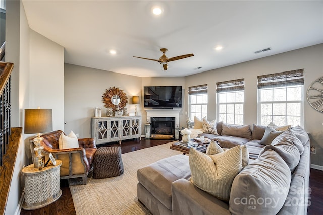 living room with ceiling fan and wood-type flooring