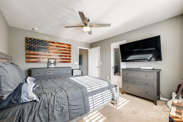 carpeted bedroom with ceiling fan and a closet