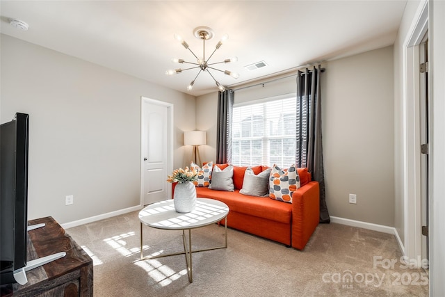 carpeted living room with a notable chandelier