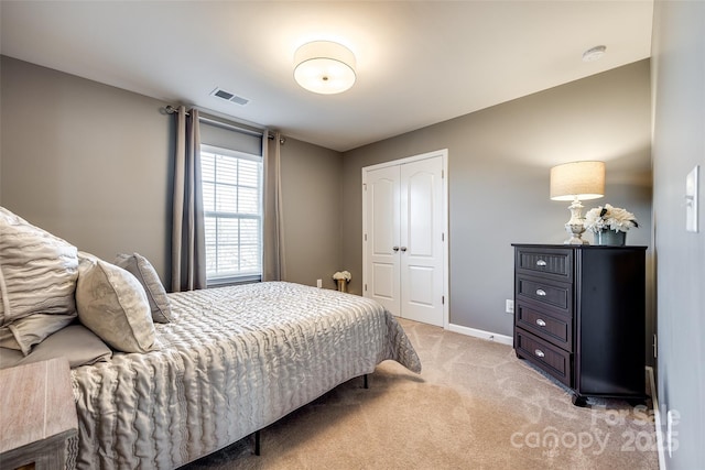 carpeted bedroom featuring a closet