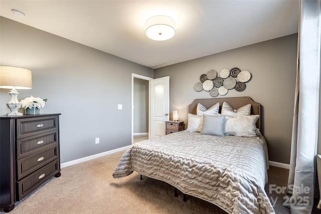 bedroom featuring light colored carpet