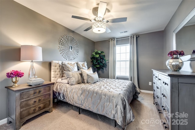 bedroom featuring light carpet and ceiling fan