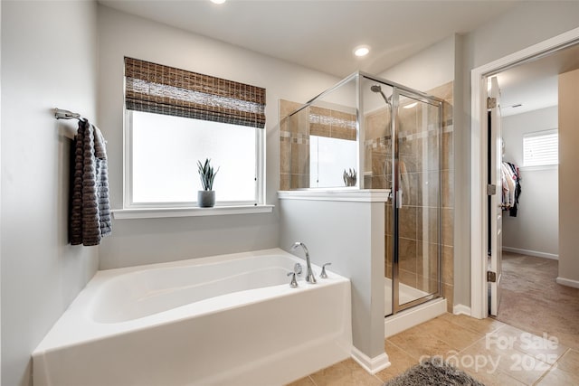 bathroom featuring tile patterned flooring and independent shower and bath