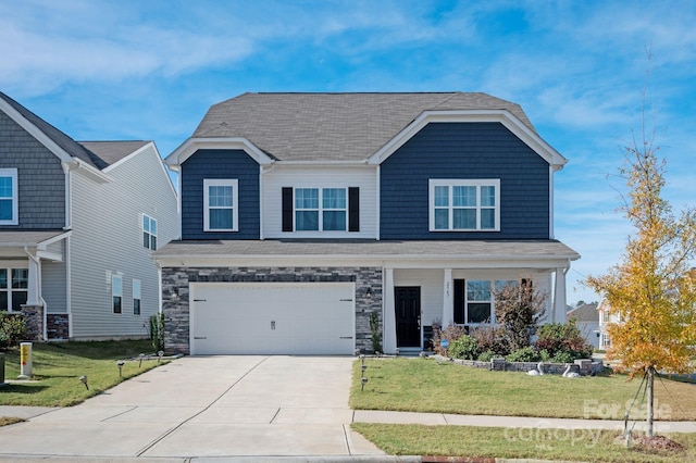 view of front of house with a garage and a front yard