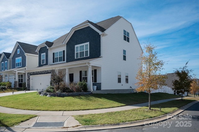 view of front of property featuring a garage and a front lawn