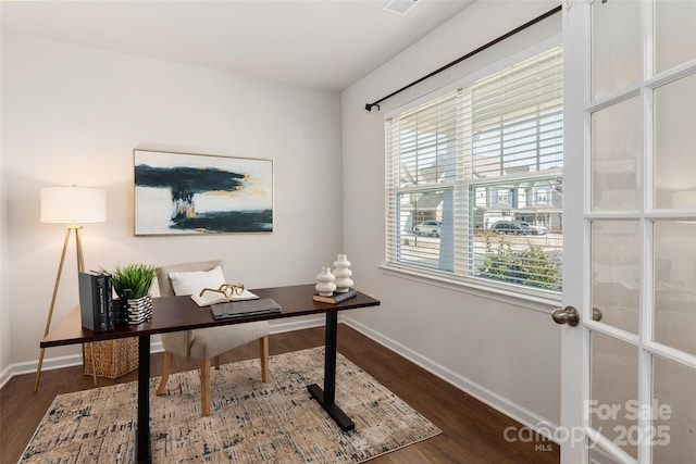 office space with dark hardwood / wood-style floors